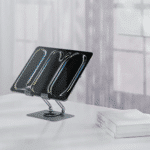 Porodo Zelo 360° Rotatable Tablet Holder with Silicone Grips - Gray Material: Carbon steel construction with silicone grips and padding Rotation: 360° rotation with multi-angle joints Compatibility: Tablets from 7" to 13" Design: Foldable, portable Use Case: Work, video calls, streaming, reading, content creation Grip: Non-slip, scratch-protective silicone grips